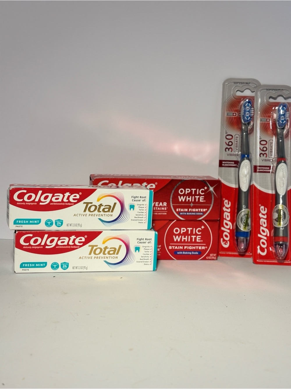 Total & Optic White Toothpaste + Toothbrushes Bundle in Red/White-Colgate